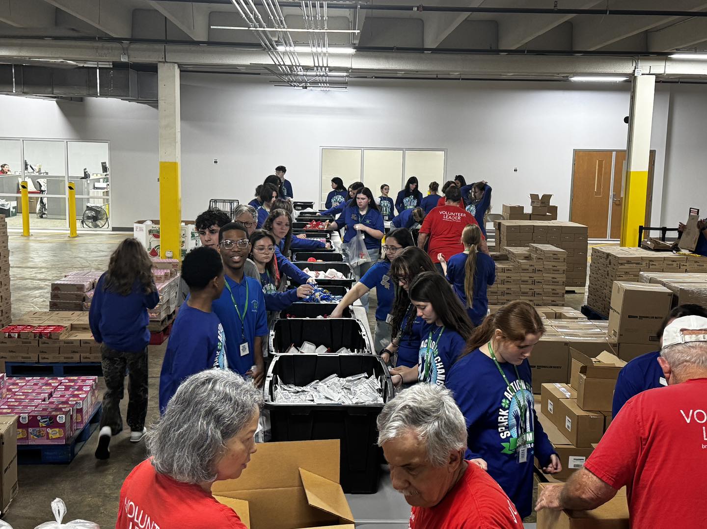 A group of people in a food bank.